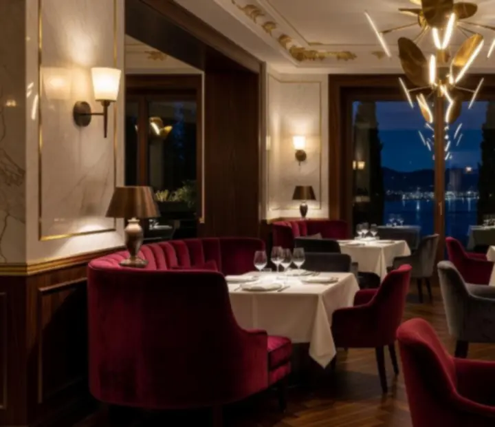 Cinematični prikaz luksuznog VIP salona Restoranice s intimnim osvjetljenjem i elegantnim sjedećim garniturama.